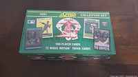 Closed box showing front with 1991 Score logo, MLB logo, player images, and text listing 900 player cards and 72 trivia cards.