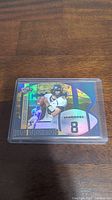 Front side of Aaron Rodgers rookie football card with holographic design and number 8