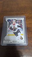Front of Brady Tkachuk rookie card showing player image, name, team, and rookie designation.