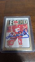 Front of Lanny McDonald rookie card showing autograph and player image