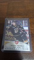Front of Mitch Marner Young Guns rookie hockey card in protective case showing player image, name and position.