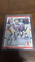 Front of Pat LaFontaine 1990 Score hockey card with autograph visible, encased in plastic.