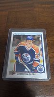 Front side of Wayne Gretzky hockey card in Edmonton Oilers uniform.
