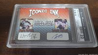 Front view of the signed card featuring Wayne Gretzky and Connor McDavid with dual cut facsimile signatures, set in protective casing.