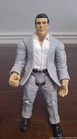 Front view of Vince McMahon WWE action figure showing detailed face and attire.