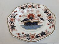 Full view of the Copeland and Garrett plate showing the floral design and gold rim.