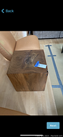 Front corner view of wood block table showing overall cube shape and auction sticker