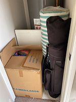 Box with fish pillows, bolster cushion and golf bag