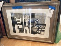 Full view of the framed print showing the triple-panel composition under glass with gold-toned frame.