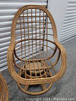 Single chair front and top view showing rattan lattice design and egg shape.