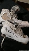 Pair of white goalie hockey skates featuring Glenn Healy's autograph, dated 1995 with NYR inscription on the outer sides.