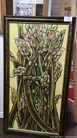 Frontal image of the framed acrylic painting showing plant-like organic forms on canvas with decorative frame.