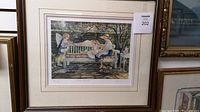 Framed limited edition print depicting a garden scene with three children on a white bench, signed by artist Trish Romance, titled Garden Retreat.