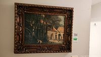 Full front view of ornate framed antique print, showing the cottage in woods scene with figures and a dog.