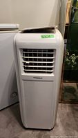 Front view of white Soleus Air portable AC unit showing air vents and logo