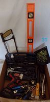Photo showing the boxed assortment including hand tools, cordless drill, hacksaw, level and tool case