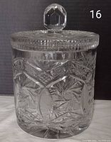 Front view of the clear crystal ice bucket showing detailed cut patterns and faceted lid knob