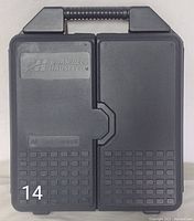 Closed view of black plastic Campbell Hausfeld branded carrying case with handle and textured surface.