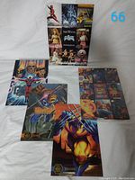 Overview photo showing 3 Marvel annual cards with different characters and 1 uncut Marvel sheet behind them.