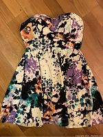 Front view of the mini dress showing the abstract pattern and sweetheart neckline.