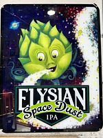 Shows full front view of sign with green hop blowing space dust, brand name and IPA descriptor, vivid colors, minor wear visible.