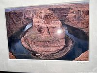 Full view of signed framed photograph depicting Horseshoe Canyon with winding river and rock formations.