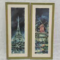 Close-up of Eiffel Tower and Moulin Rouge framed prints with art details visible