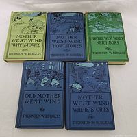 Full view of all 5 vintage children's hardcover books by Thornton W. Burgess with illustrated covers.