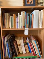 Bookshelf showing a variety of books including literature, gardening, Shakespeare and cooking titles.