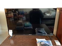 Photo of the Hisense 32 inch TV model 32A4GV from the front, showing the black bezel and logo.