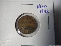 Photo of the reverse side of the 1942 Newfoundland penny showing date and denomination.