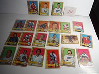 All 21 hockey cards laid out showing various players and teams from the 1972-73 OPC hockey card series.