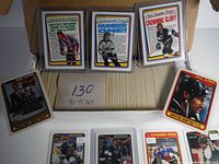 Display of various Wayne Gretzky cards from Art Ross, Kings, and All-Star editions with colorful borders and player photos