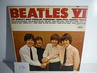 Front cover of The Beatles VI vinyl album featuring the band members and bold red title text.