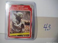 Front view of Yoda collectible card in protective sleeve showing the card art, border and labeling.