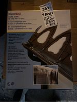 Box packaging showing front and branding of Easy Heat Roof & Gutter De-icing Kit ADKS with a photo of roof icicles and product information in multiple languages.