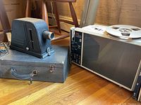 Eumig R2000 Instaprojection projector alongside Spencer Buffalo slide projector on the floor