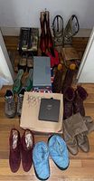 Top-down view showing all shoes and boots with boxes and various styles in different colors including burgundy, red, tan, blue, gray, green, brown.