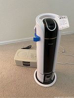 Photo showing both the Sony CD radio and the Costway air cleaner together on carpeted floor.