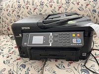 Front and left side view of the EPSON WorkForce WF-3620 printer showing the LCD, keypad, and function buttons.