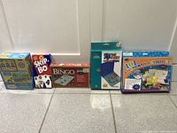 Six boxed kids games lined up showing titles and condition