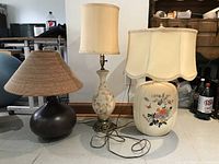 Three large lamps together showing different styles and shades.