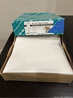 Box of 100 white 10 x 13 inch Tech-No-Tear catalog envelopes by Quality Park Products, showing size and model details on the box.