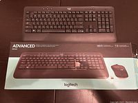 Top view of Logitech Advanced MC540 wireless keyboard on box illustrating the full layout and device branding.