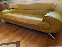 Front-left angle showing entire couch and chrome angled legs