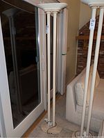 Full view of the floor lamp showing its height, base, and body.