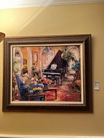 Full view of the framed painting showing the entire artwork with the brown patterned frame and linen mat around the painting of a piano and flowers in an interior.