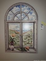 Front view of the original wall art showing arched window and scenic landscape with flowers.