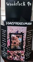 Full front view of Woodstock 1994 promotional display showing Woodstock 94 text, crowd photo and artist names