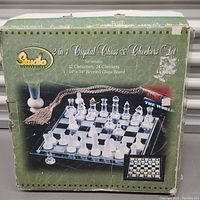 Front of original product box showing the 2 in 1 Crystal Chess and Checkers Set by Sun-Sco with 32 chessmen, 24 checkers, and 14x14 inch beveled glass board.